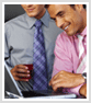 Two men at laptop