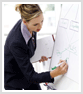 Woman drawing on flip chart